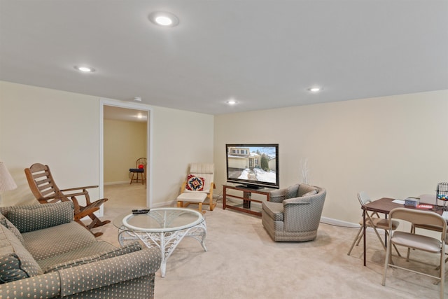 living room featuring recessed lighting, light colored carpet, and baseboards