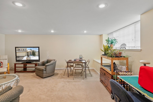 living area featuring recessed lighting, baseboards, and carpet floors