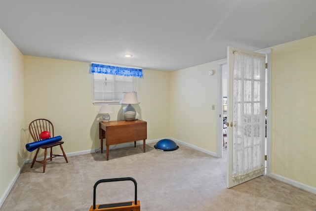 interior space featuring carpet flooring and baseboards