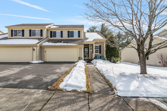 view of front of house with aphalt driveway and an attached garage