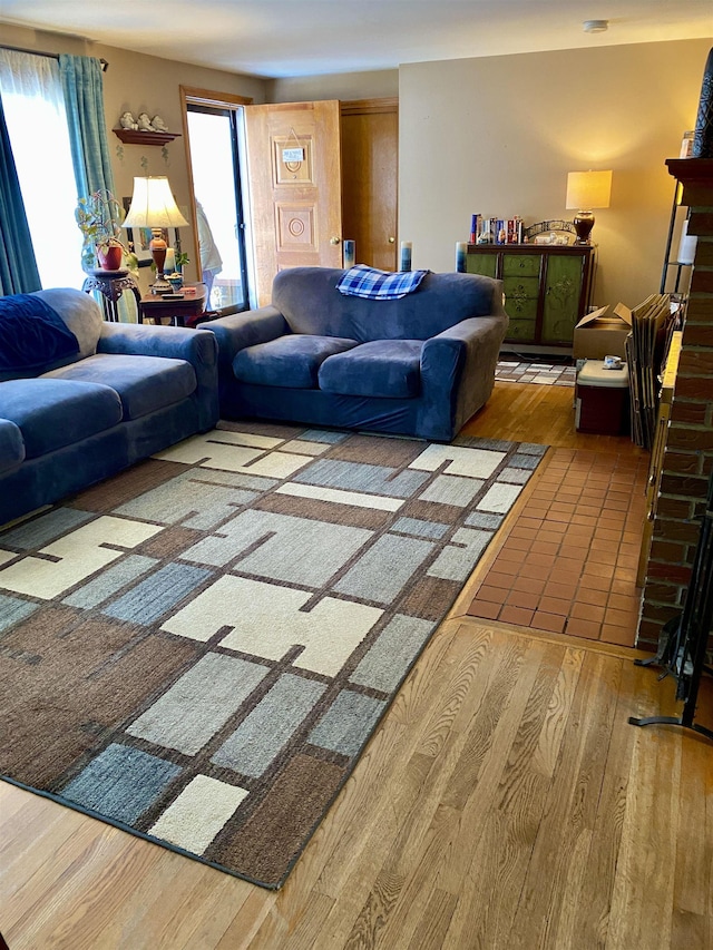 living room featuring hardwood / wood-style flooring and a fireplace