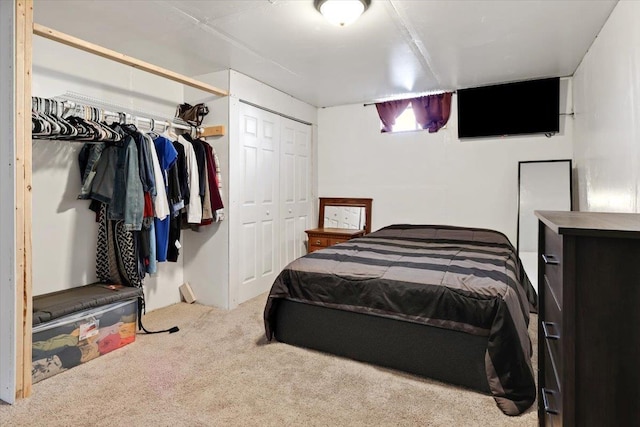 carpeted bedroom featuring multiple closets