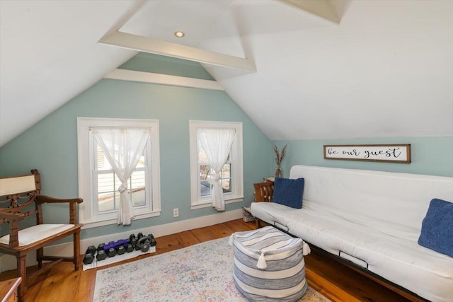 sitting room with vaulted ceiling, wood finished floors, and baseboards