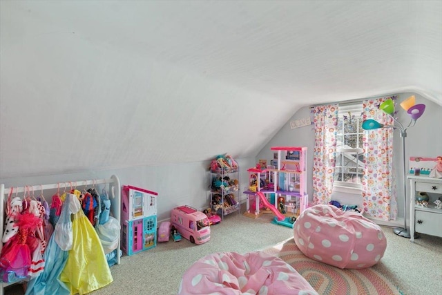 recreation room with lofted ceiling and carpet