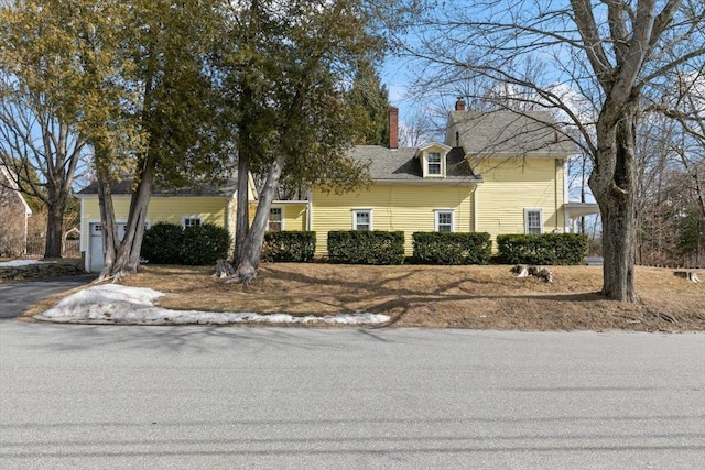 cape cod house with a chimney