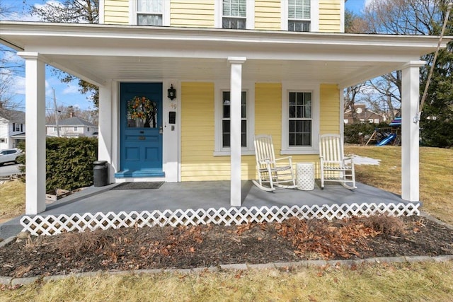 doorway to property with a porch