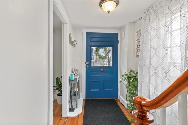 foyer featuring wood finished floors