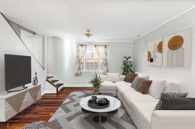 living area with dark wood finished floors, stairs, baseboards, and ornamental molding