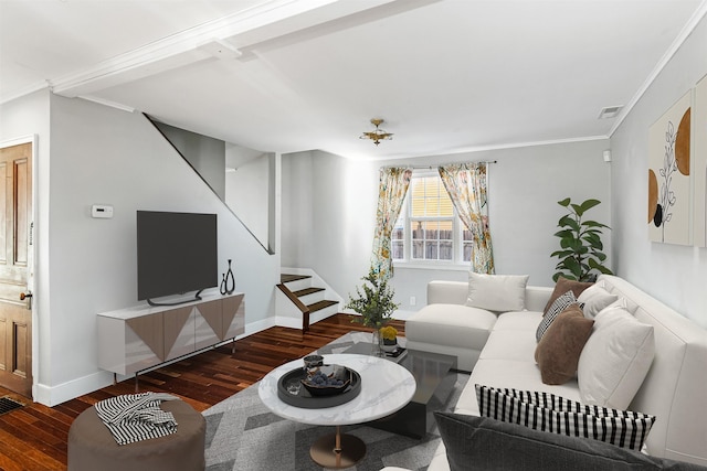 living area with visible vents, wood finished floors, stairway, crown molding, and baseboards