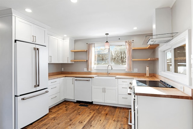 kitchen with white appliances, open shelves, a sink, white cabinetry, and island range hood