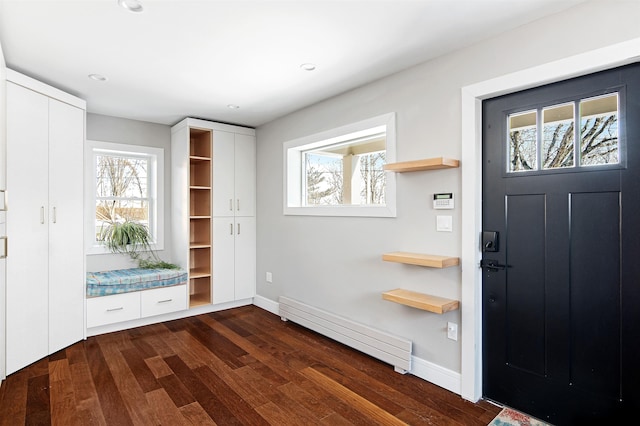 entryway featuring recessed lighting, a baseboard radiator, baseboards, and dark wood-style floors