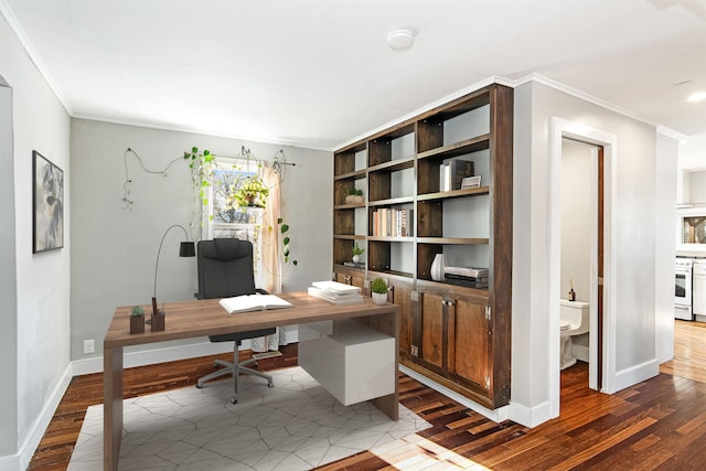 office featuring ornamental molding, baseboards, and wood finished floors