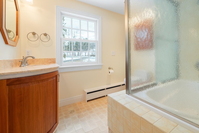 full bathroom with vanity, a baseboard radiator, tiled tub, a shower, and tile patterned floors