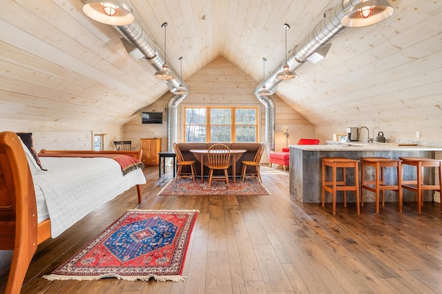 bedroom with hardwood / wood-style floors, wooden ceiling, wood walls, and lofted ceiling