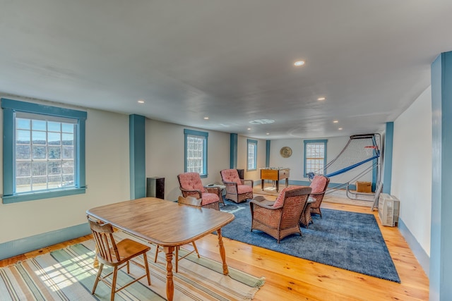 dining area with recessed lighting, light wood-type flooring, and baseboards