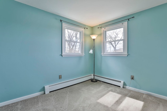 unfurnished room featuring baseboards, carpet, and baseboard heating