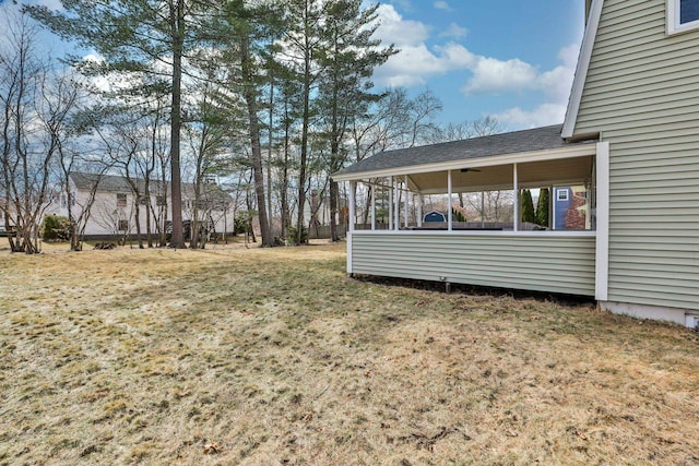 view of yard with a sunroom