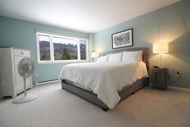 carpeted bedroom featuring baseboards and baseboard heating