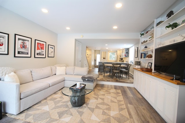 living room with recessed lighting and wood finished floors