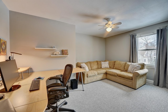 carpeted home office with ceiling fan