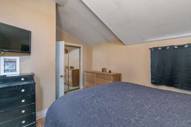 bedroom featuring vaulted ceiling