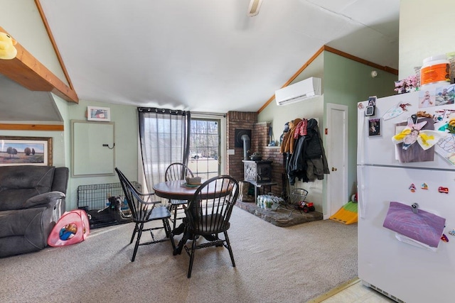 dining space with an AC wall unit, a wood stove, carpet, and lofted ceiling