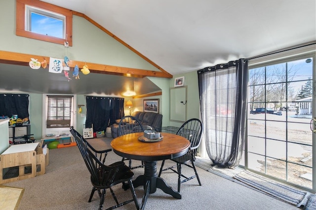 dining area with carpet, a healthy amount of sunlight, and high vaulted ceiling