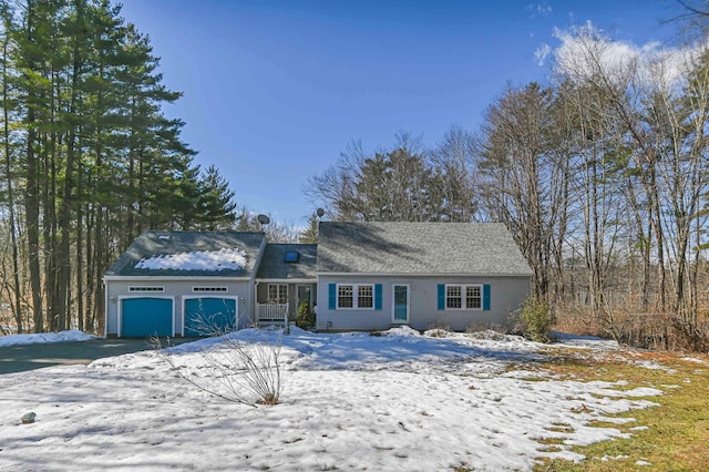 view of front of property with aphalt driveway and an attached garage