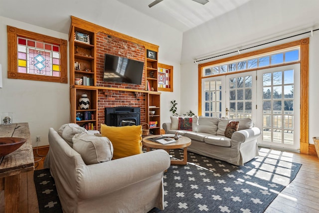 living room featuring a ceiling fan and hardwood / wood-style floors