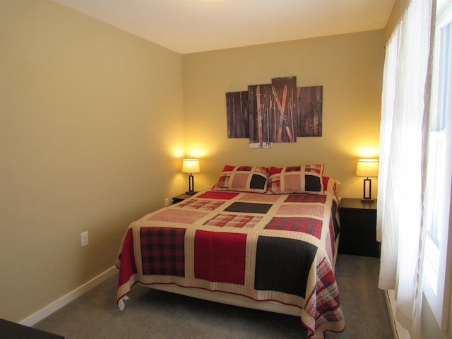 carpeted bedroom with baseboards