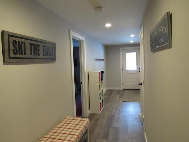 hall featuring dark wood finished floors, recessed lighting, and baseboards