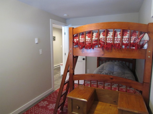 bedroom with baseboards and a baseboard radiator