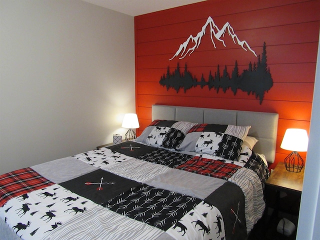 bedroom with wood walls