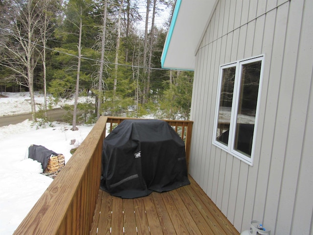 snow covered deck with area for grilling