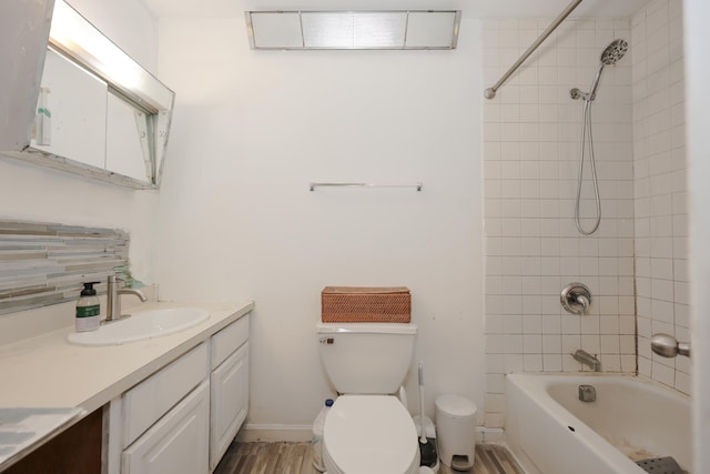 full bathroom with vanity, baseboards, visible vents, bathing tub / shower combination, and toilet