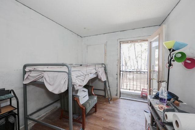 bedroom with wood finished floors