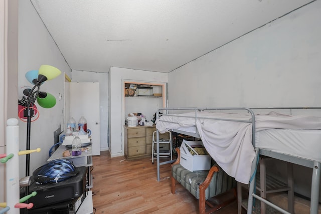 bedroom with wood finished floors