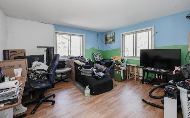 office area with a healthy amount of sunlight and wood finished floors