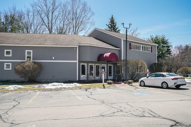 view of building exterior featuring uncovered parking