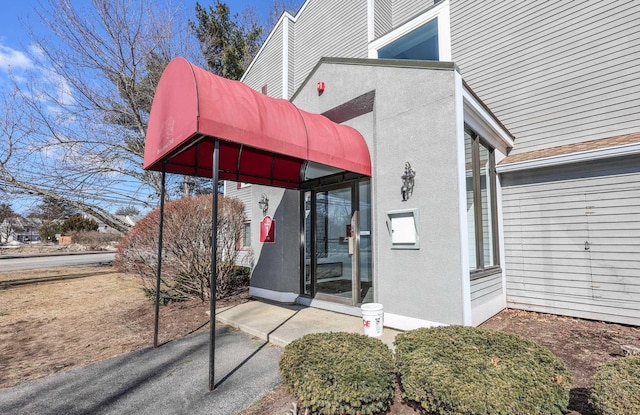 exterior space featuring stucco siding