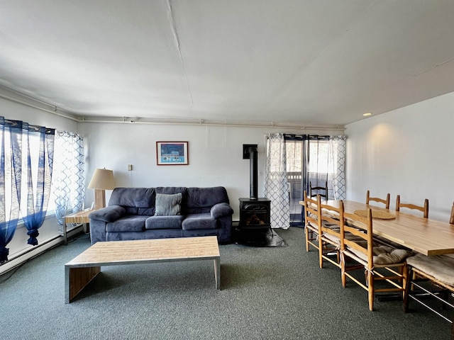 living room with dark carpet and a wood stove