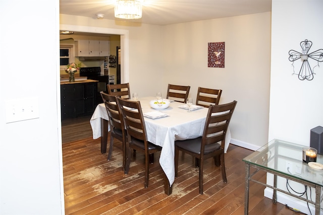 dining room with wood finished floors and baseboards