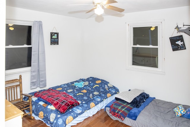 bedroom featuring a ceiling fan and wood finished floors