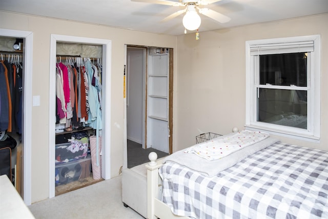 carpeted bedroom featuring a ceiling fan and a closet