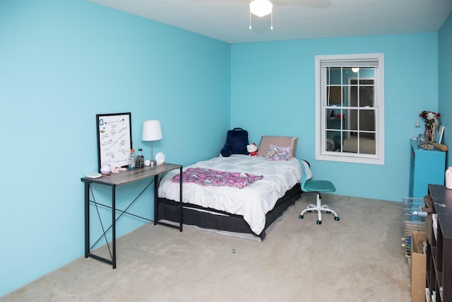 carpeted bedroom with a ceiling fan