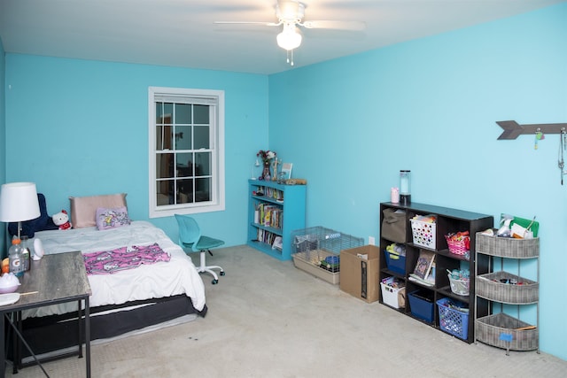 bedroom with a ceiling fan and carpet