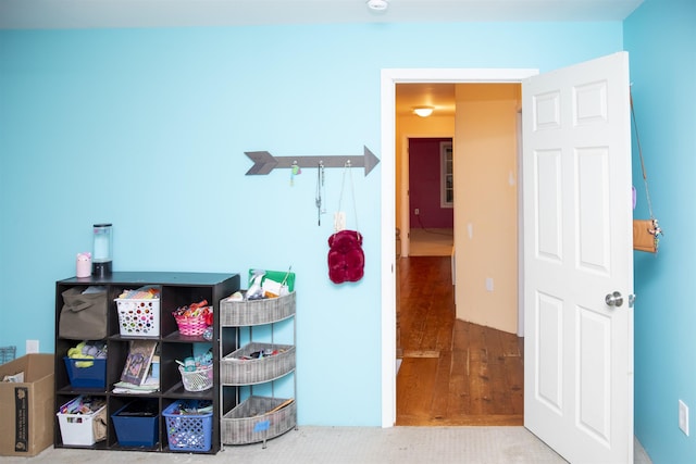 corridor with wood finished floors