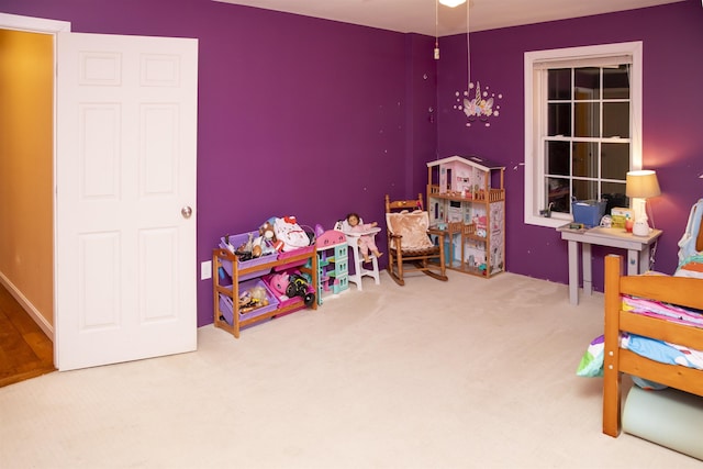 recreation room with carpet flooring