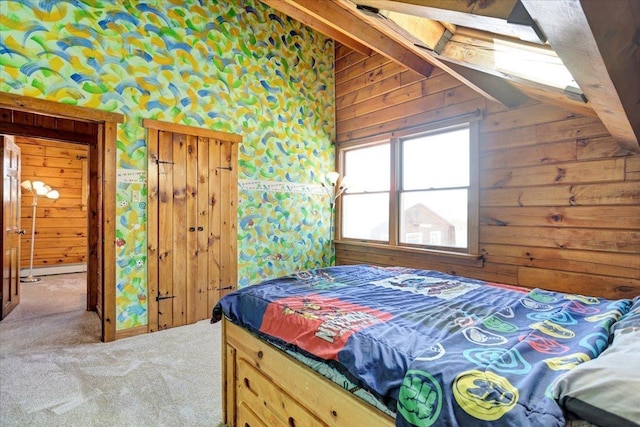 bedroom with light carpet, wooden walls, and lofted ceiling