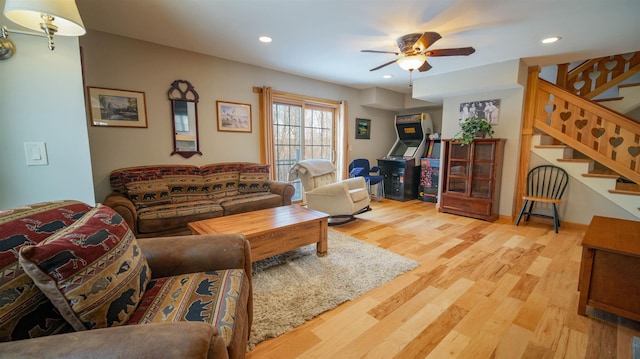 living area featuring stairs, recessed lighting, wood finished floors, and ceiling fan